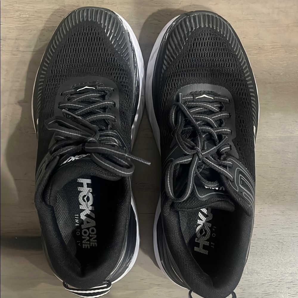 Hoka Black athletic shoes